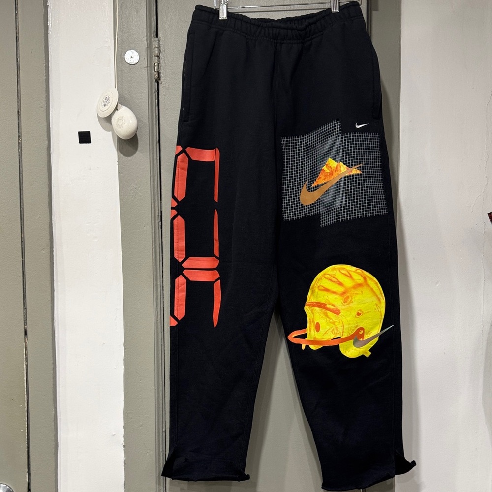 Nike Black Sweatpants with Bold Graphic Accents